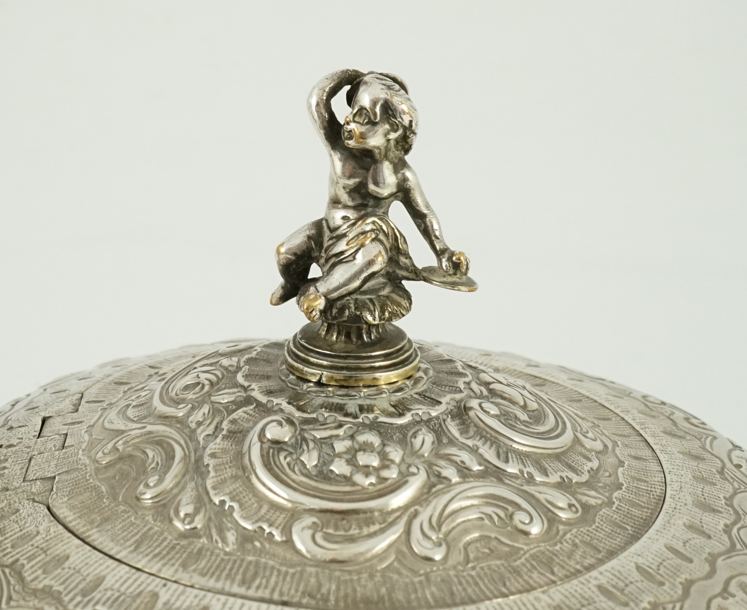 A George III silver rococo style inverted pear shaped pedestal teapot by Robert Garrard I
